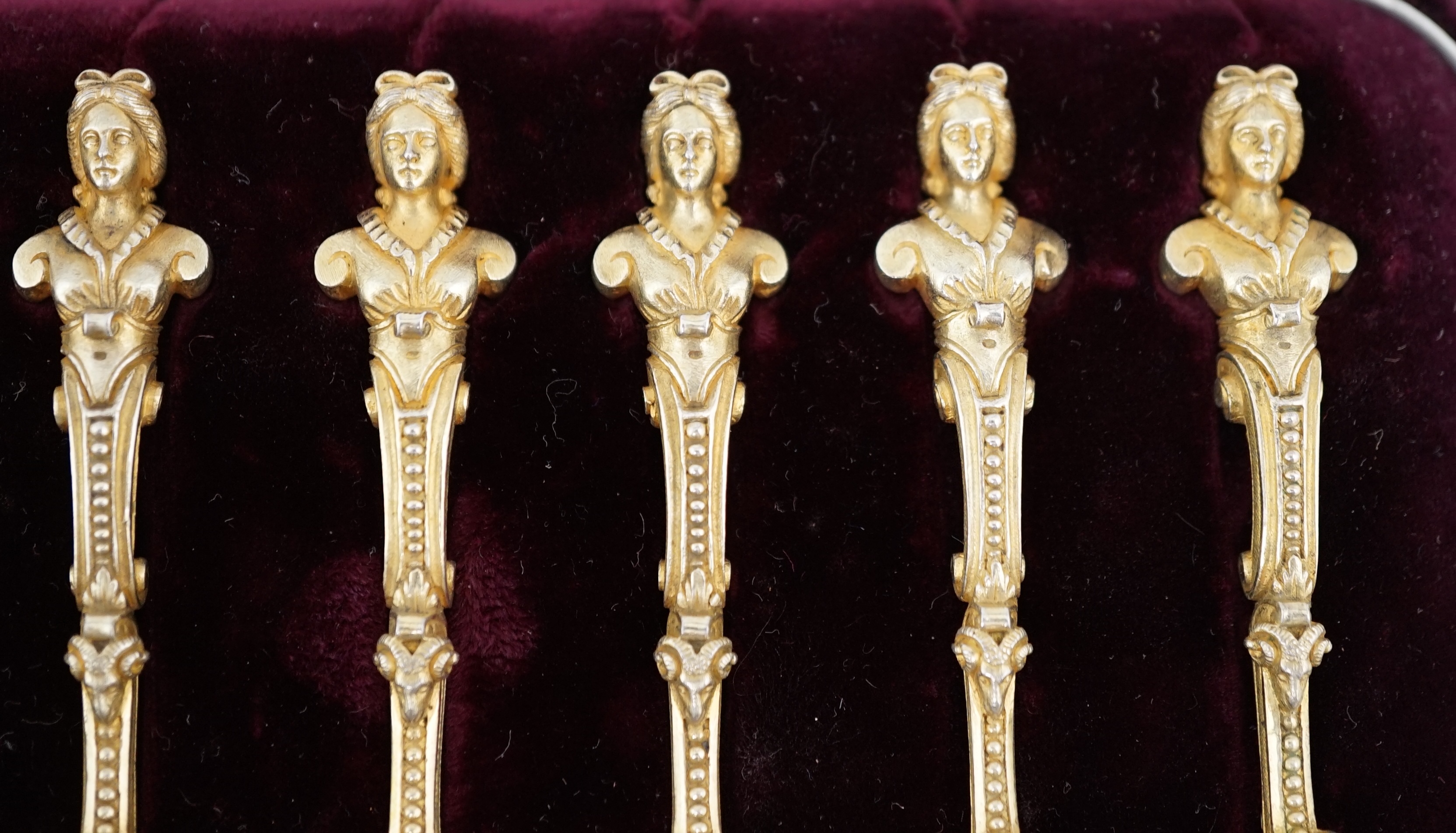 A cased set of twelve late 19th century Russian 84 zolotnik silver gilt caviar spoons by F.E. Henriksen, St. Petersburg